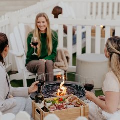 Get cosy with wine and charcuterie around a fire pit at Winter in the Garden
