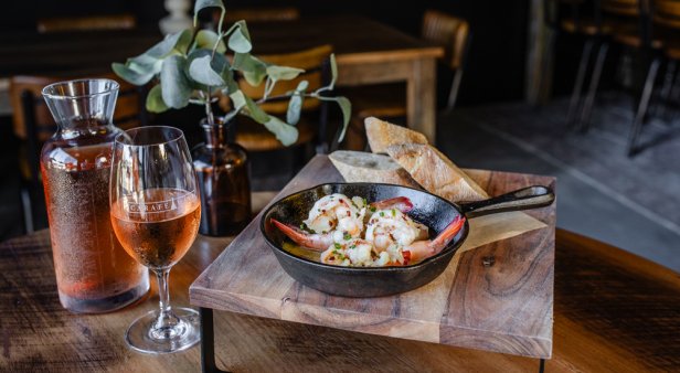 Embrace the temperature shift with shiraz and baked camembert by the fire pit at Carafe Wine